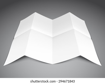 Folded white paper sheet on grey background