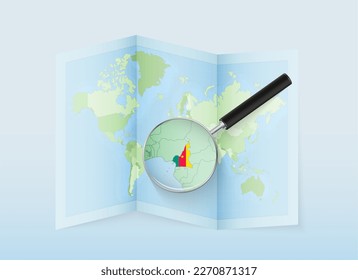 A folded world map with a magnifying lens pointing towards Cameroon. Map and flag of Italy in loupe. Vector illustration in blue color tone.