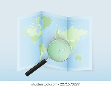 A folded world map with a magnifying lens pointing towards Rwanda. Map and flag of Italy in loupe. Vector illustration in blue color tone.