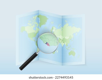 A folded world map with a magnifying lens pointing towards Liberia. Map and flag of Italy in loupe. Vector illustration in blue color tone.