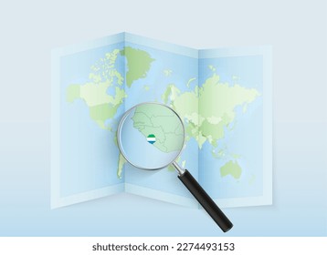 A folded world map with a magnifying lens pointing towards Sierra Leone. Map and flag of Italy in loupe. Vector illustration in blue color tone.