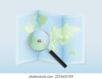 A folded world map with a magnifying lens pointing towards Suriname. Map and flag of Italy in loupe. Vector illustration in blue color tone.