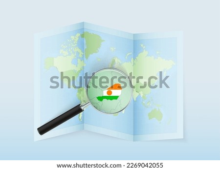 A folded world map with a magnifying lens pointing towards Niger. Map and flag of Italy in loupe. Vector illustration in blue color tone.