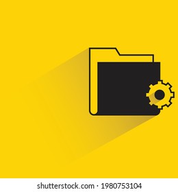 folder and gear icon with shadow on yellow background