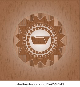 folder icon inside badge with wood background