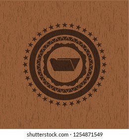 folder icon inside badge with wood background