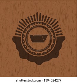 folder icon inside wooden emblem