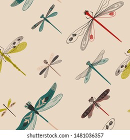 Folk art ornate insects background. Colorful seamless pattern of dragonflies with decorated wings. 