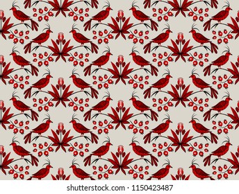 a folk ornament with red birds and flowers