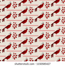 a folk ornament with red birds and flowers