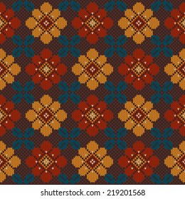 Folk seamless pattern with flowers on the wool knitted texture