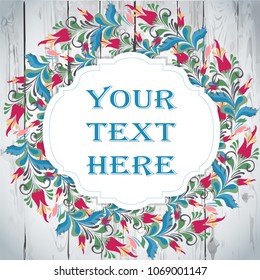 Folk wreath in a vintage rustic style with flowers and floristic elements on a wooden background, greeting card