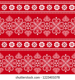 Folklore floral Nordic Scandinavian pattern vector seamless. Ethnic border ornament with snowflakes, hearts and flowers. Sweater design for holiday fabric, gift wrapping paper, season background.