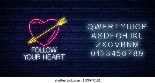 Follow your heart - glowing neon motivation phrase with alphabet on dark brick wall background. Motivation quote in neon style. Vector illustration.
