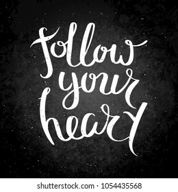 Follow your heart. Hand written calligraphy quote motivation for life and happiness on blackboard. For postcard, poster, prints, cards graphic design.