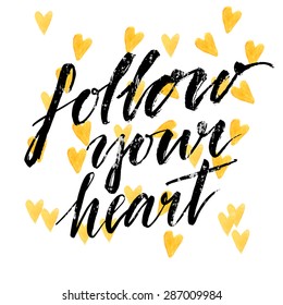 Follow your heart - modern calligraphy phrase handwritten on watercolor golden hearts background. Vector card design