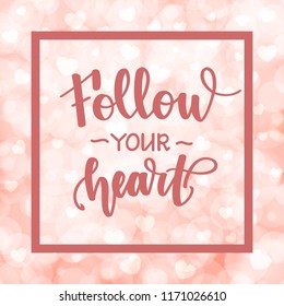 Follow your heart. Motivational and inspirational handwritten lettering on blurred bokeh background with hearts. Vector illustration for posters, cards and much more.