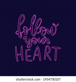 Follow your heart. Neon Inspirational phrase. Calligraphic hand lettering motivational inscription for postcard, poster, wallpaper. Vector illustration.