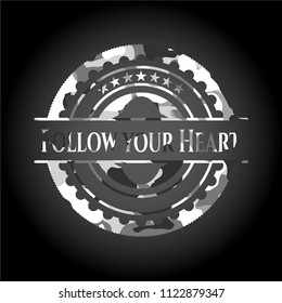 Follow your Heart written on a grey camouflage texture