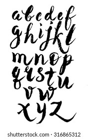 Font, alphabet written in chalk on a black school Board. The alphabet written with a marker on blackboard. Poster with calligraphic font is written with a brush. A lettering.