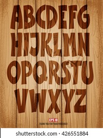 Font graffiti style. Cartoon words on a wooden background. Lacquer effect