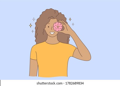 Food, Beauty, Junk Food, Advertising, Fun Concept. Young Happy Smiling Cheerful African American Woman Girl Character Holding Doughnut On Eye. Having Fun With Sweets And Unhealthy Nutrition Promotion.