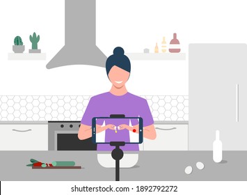 Food blogger streaming live. A smiling woman breaking an egg and records an online cooking video tutorial on her phone. Woman communicating with subscribers through phone camera. Eps 10