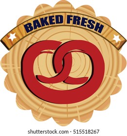 Food icons against wood plaque of pretzel 