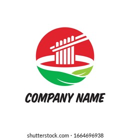 
food logo concept: noodles on green bowl are taken with chopsticks 