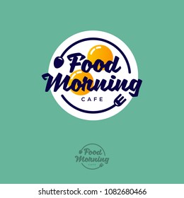 Food Morning logo. Breakfast cafe emblem. Fried eggs fork and spoon on a green background. Typography. Lettering design.