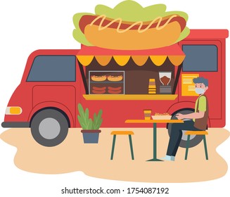 Food truck selling hotdog complete with some chair and table for customer illustration