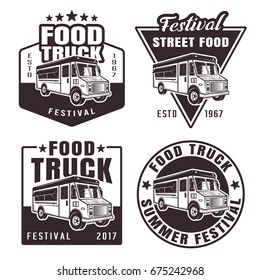 Food truck set of four black vector emblems, badges, stickers or logos in vintage style isolated on white background