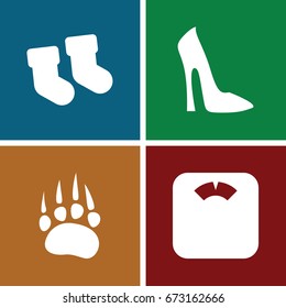 Foot icons set. set of 4 foot filled icons such as animal paw, baby socks, woman shoe
