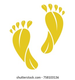 foot made by yellow leaves  isolated on a  white background