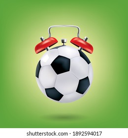 Football Alarm Clock On Green Background.