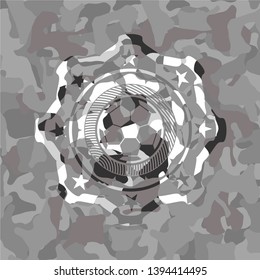 football ball icon on grey camouflaged texture