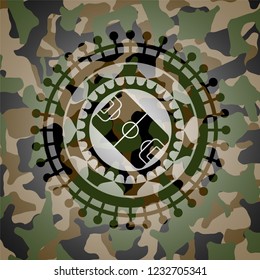 football field icon inside camo emblem