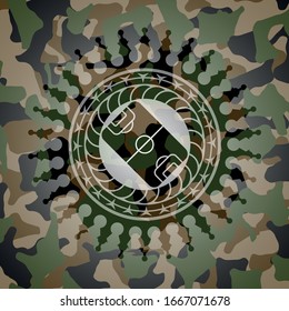 football field icon inside camouflaged emblem