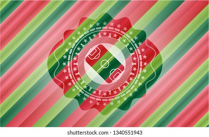 football field icon inside christmas colors style badge.