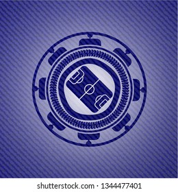 football field icon inside emblem with denim high quality background