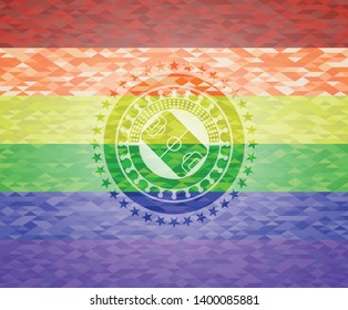 football field icon inside emblem on mosaic background with the colors of the LGBT flag