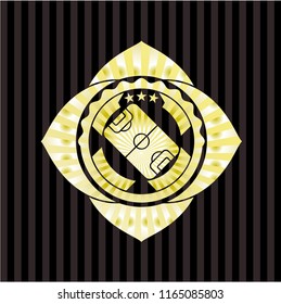 football field icon inside golden emblem or badge