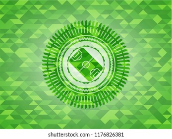 football field icon inside realistic green emblem. Mosaic background
