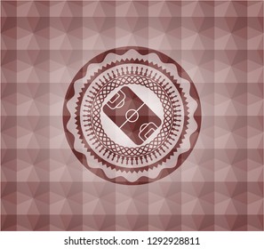 football field icon inside red seamless emblem with geometric pattern.