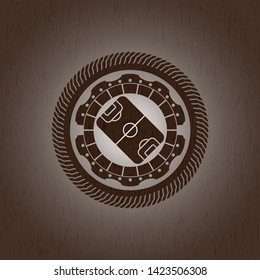football field icon inside retro wooden emblem