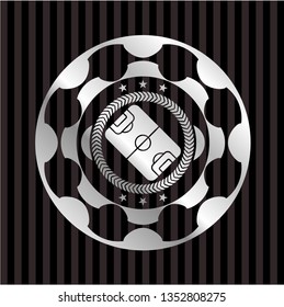 football field icon inside silvery badge or emblem