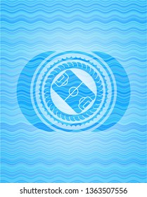 football field icon inside sky blue water badge background.