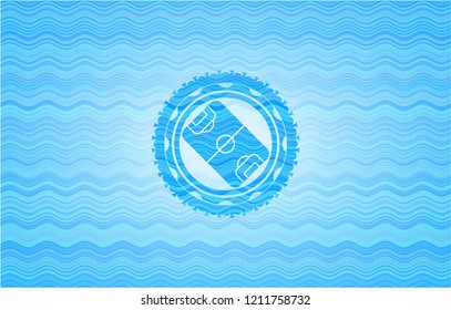 football field icon inside water representation style badge.