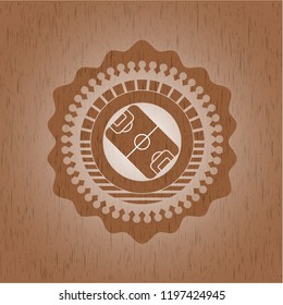 football field icon inside wood emblem