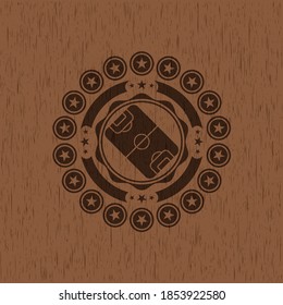 football field icon inside wood emblem. 